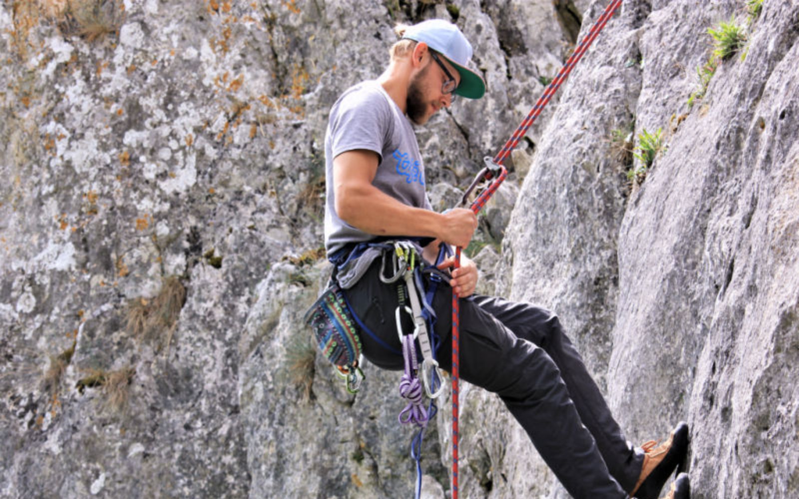 Themed picture of a climber abseiling down a rock.